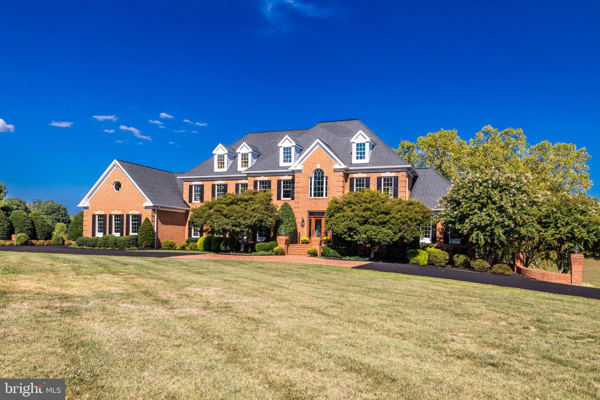 22609 Hillside Circle Leesburg, VA 20175 - Photo 4 of 110 a front view of a house with a yard