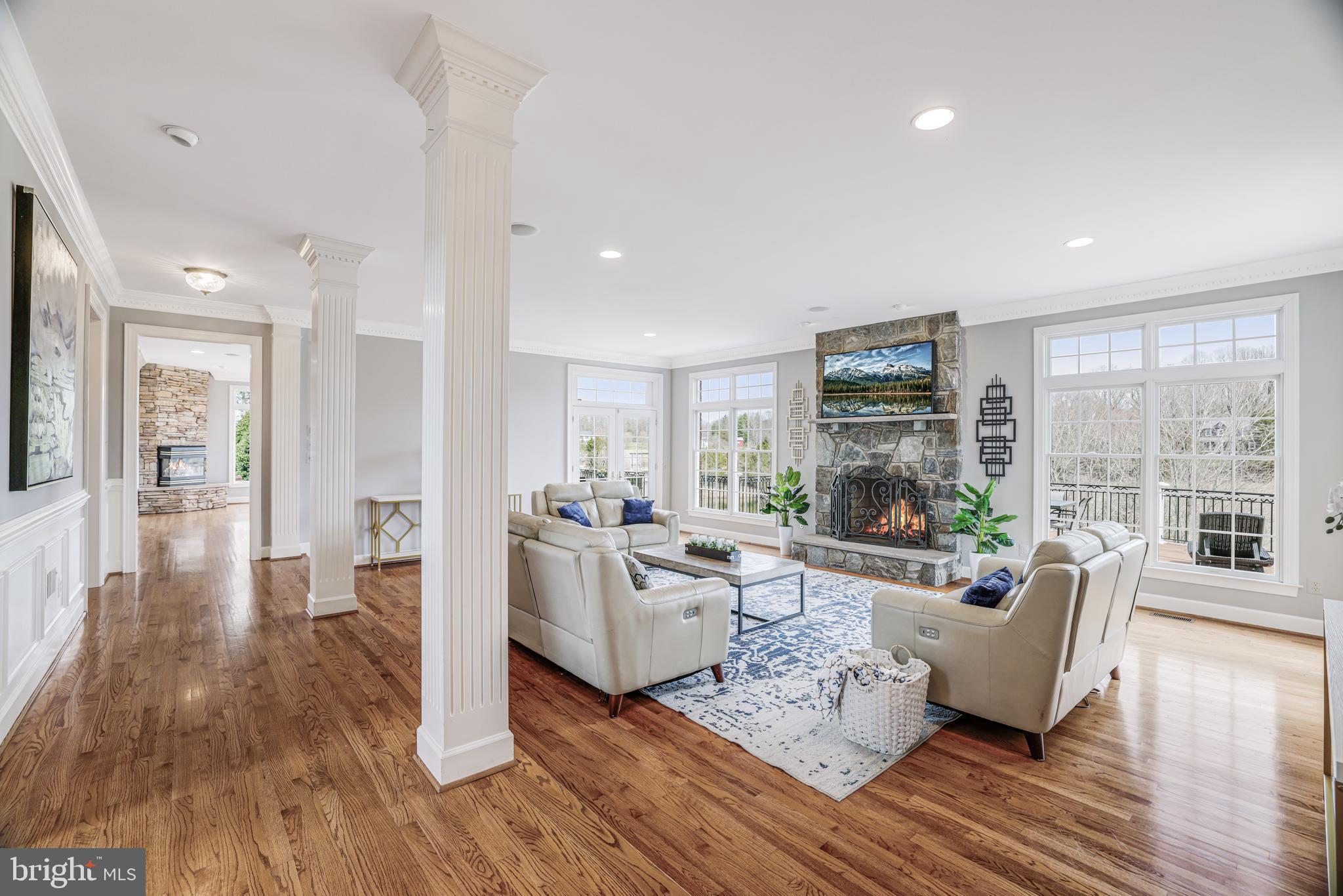 22609 Hillside Circle Leesburg, VA 20175 - Photo 47 of 110 a living room with furniture wooden floor and a fireplace