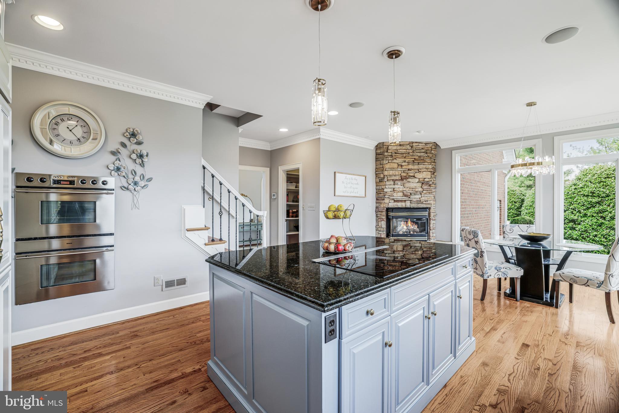 22609 Hillside Circle Leesburg, VA 20175 - Photo 57 of 110 a kitchen with stainless steel appliances granite countertop a stove and a large window