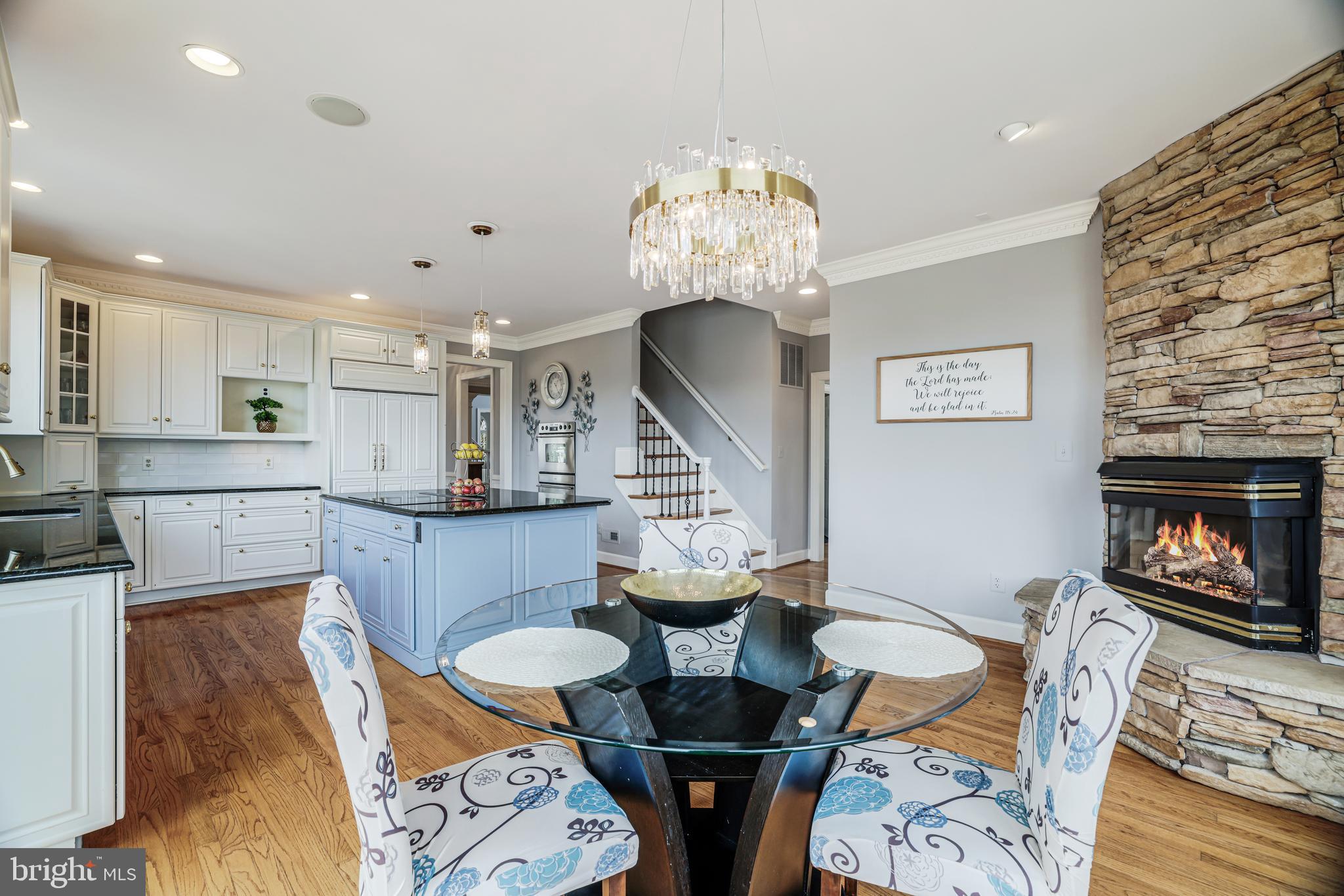 22609 Hillside Circle Leesburg, VA 20175 - Photo 60 of 110 a living room with fireplace furniture and a chandelier