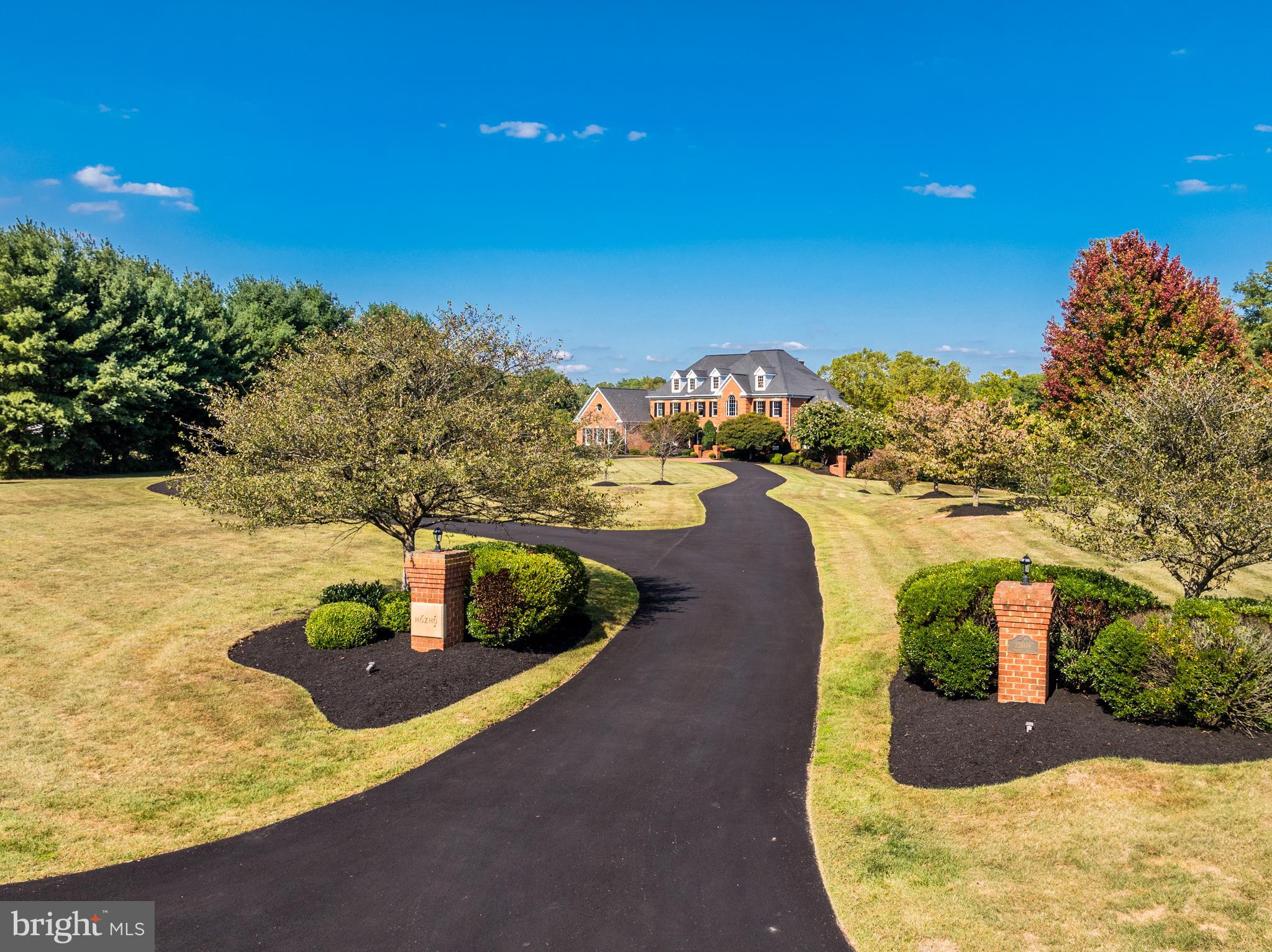 22609 Hillside Circle Leesburg, VA 20175 - Photo 6 of 110 a view of a swimming pool with an outdoor space and seating area