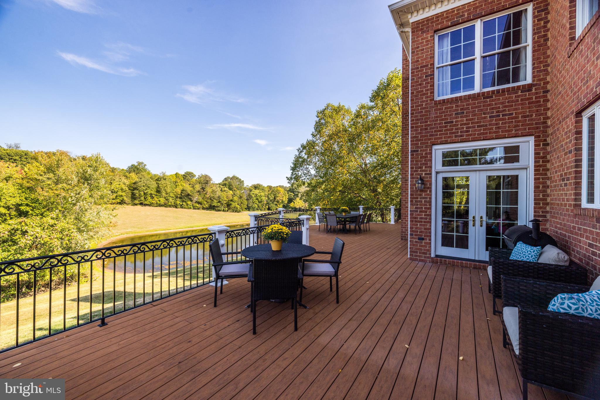 22609 Hillside Circle Leesburg, VA 20175 - Photo 10 of 110 a view of a balcony with wooden floor and outdoor seating