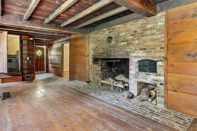 an empty room with fireplace