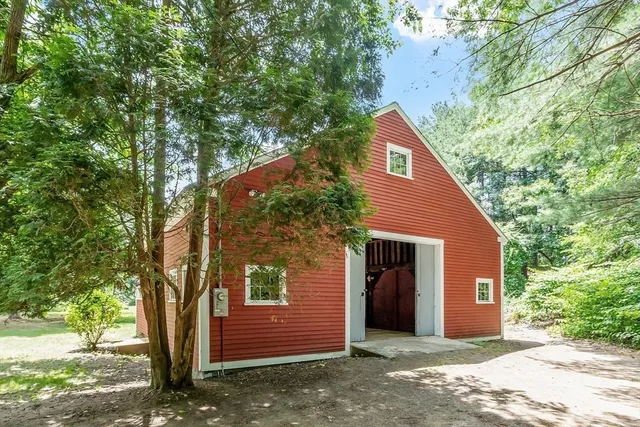 a view of a house with a tree
