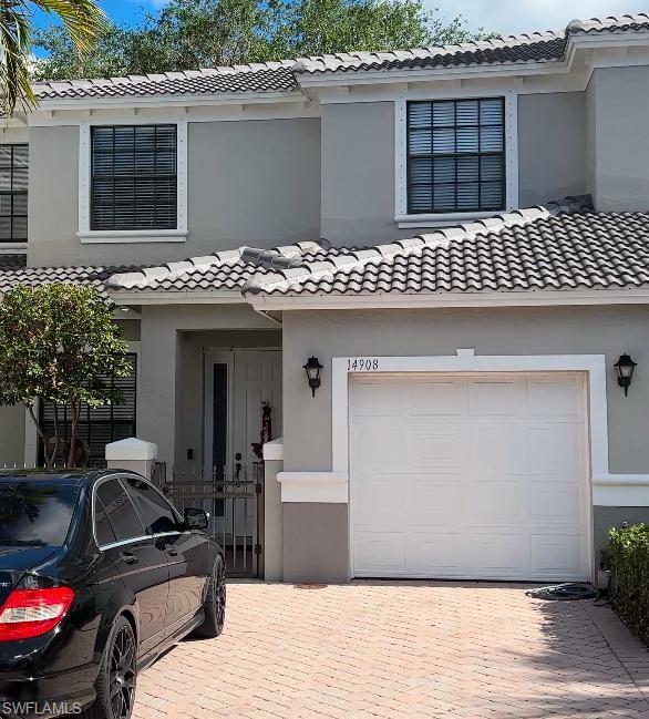 a front view of a house with a garage
