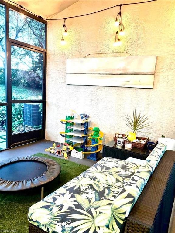 14908 Summit Pl Circle, Unit 26 Naples, FL 34119 - Photo 11 of 26 a table with chairs and window