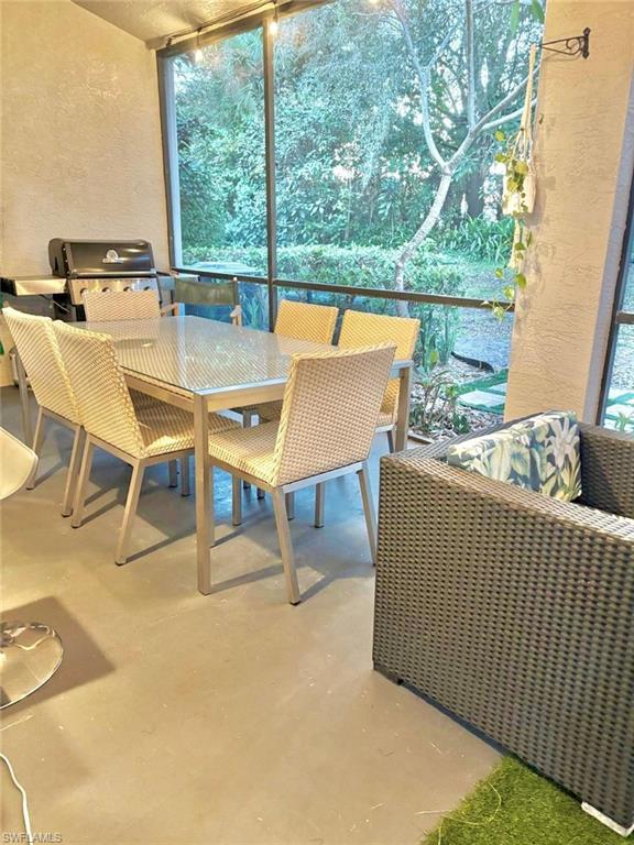 14908 Summit Pl Circle, Unit 26 Naples, FL 34119 - Photo 12 of 26 a outdoor view with a sitting space