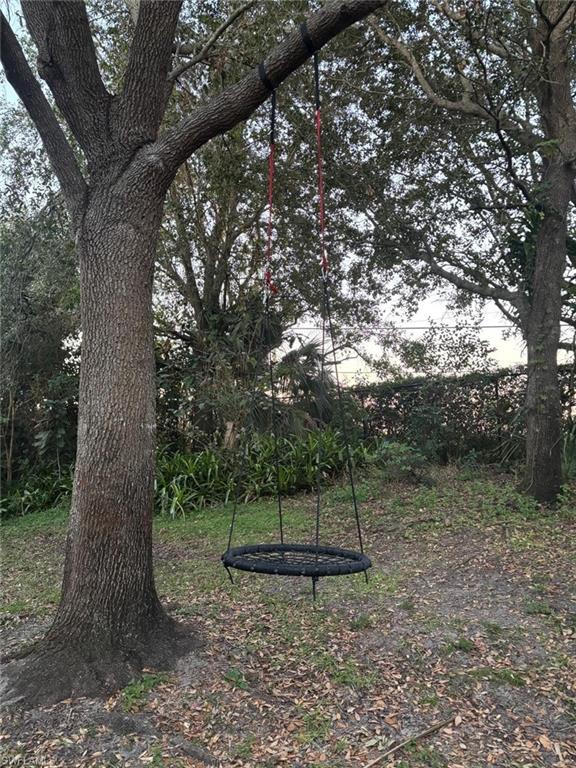 14908 Summit Pl Circle, Unit 26 Naples, FL 34119 - Photo 15 of 26 a view of a tree in a yard