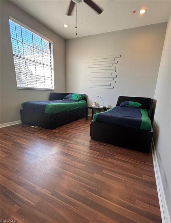 14908 Summit Pl Circle, Unit 26 Naples, FL 34119 - Photo 19 of 26 a bedroom with a bed and a window