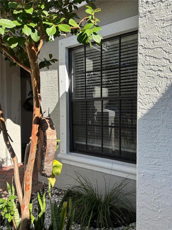 14908 Summit Pl Circle, Unit 26 Naples, FL 34119 - Photo 2 of 26 a view of a backyard