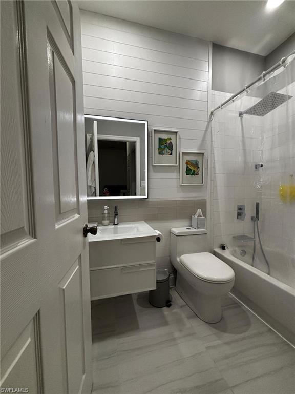 14908 Summit Pl Circle, Unit 26 Naples, FL 34119 - Photo 23 of 26 a bathroom with a double vanity sink mirror and toilet