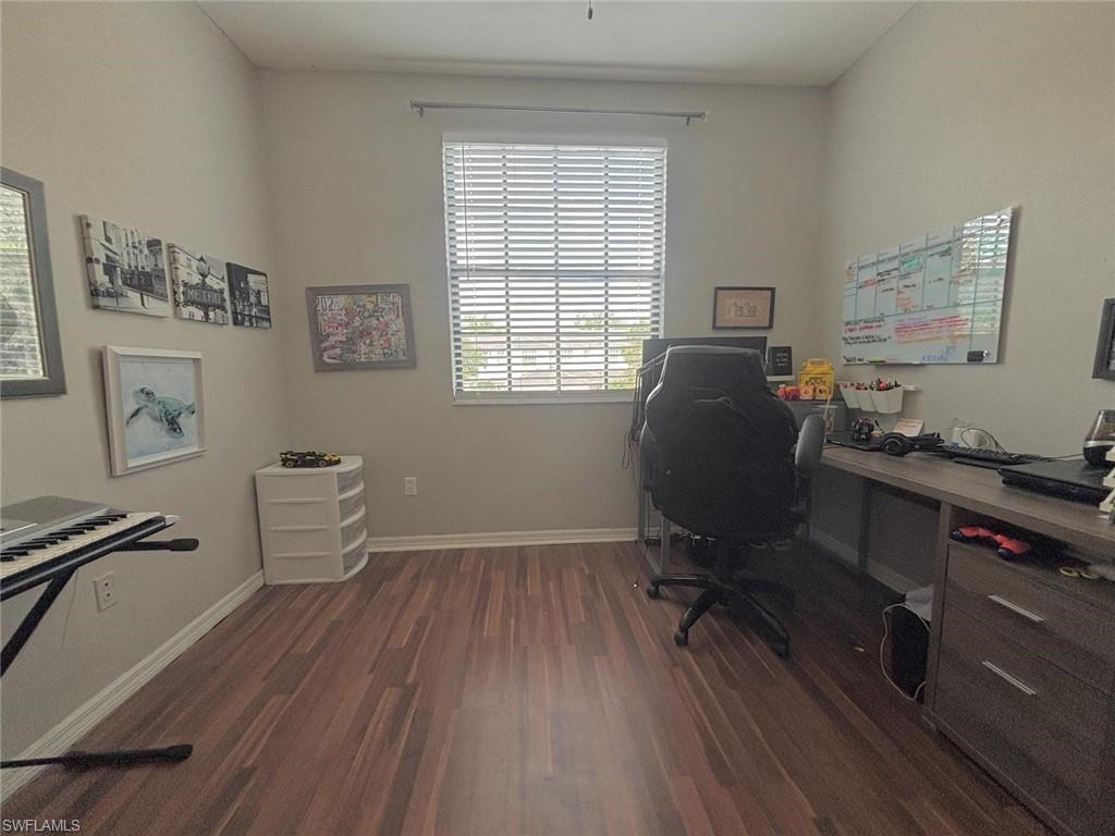 14908 Summit Pl Circle, Unit 26 Naples, FL 34119 - Photo 26 of 26 a view of a workspace with furniture and a window