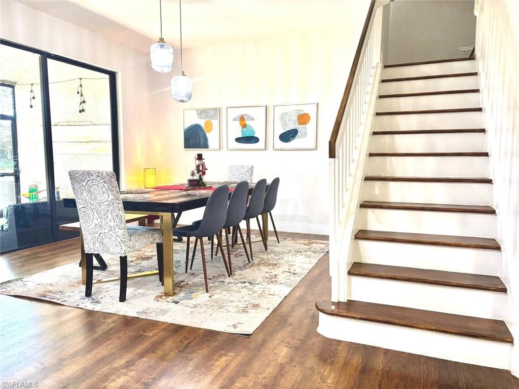 14908 Summit Pl Circle, Unit 26 Naples, FL 34119 - Photo 10 of 26 a view of a dining room with furniture and wooden floor
