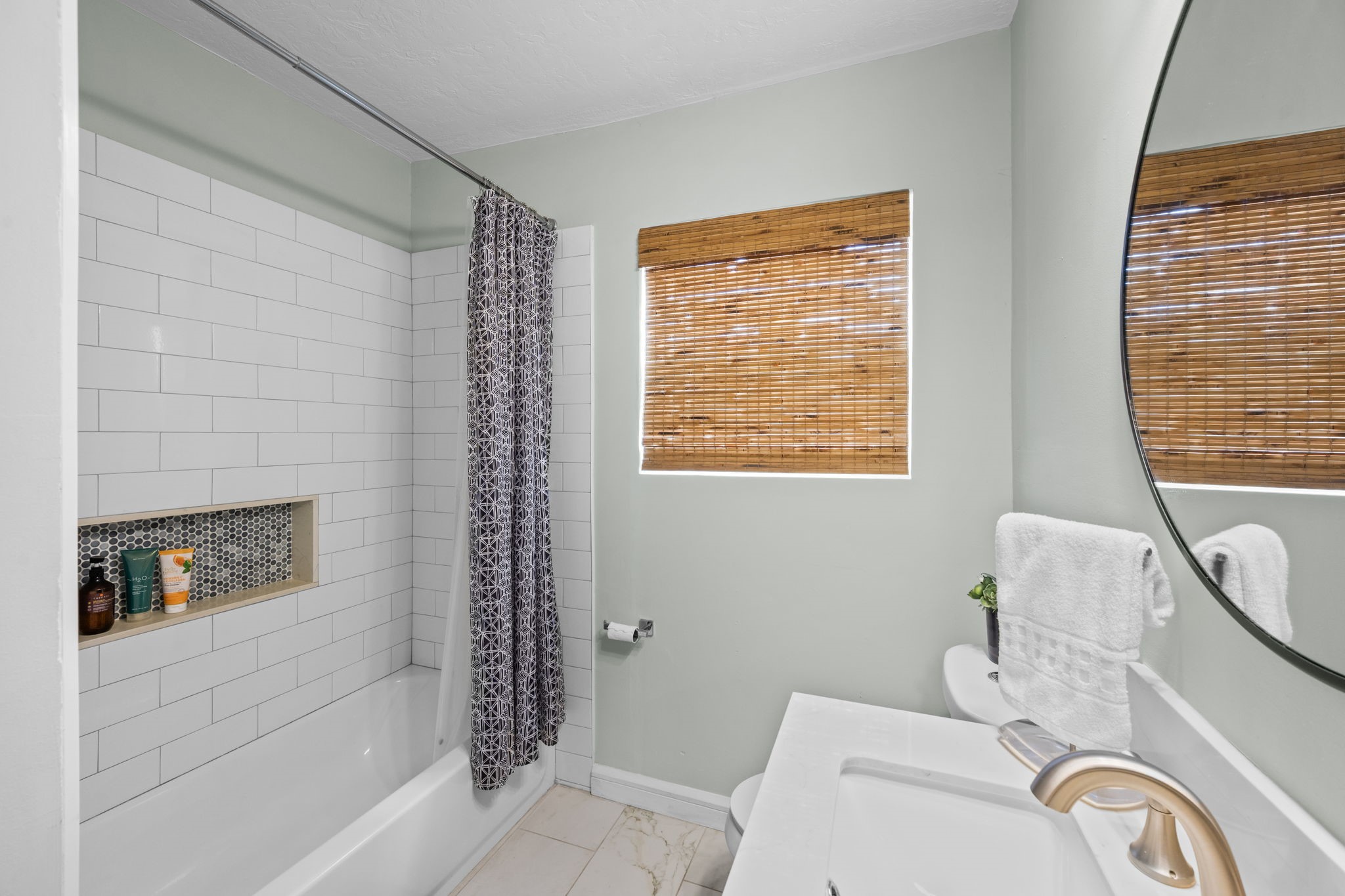 5519 Hillman Street Houston, TX 77023 - Photo 11 of 22 a bathroom with a granite countertop sink a toilet and shower