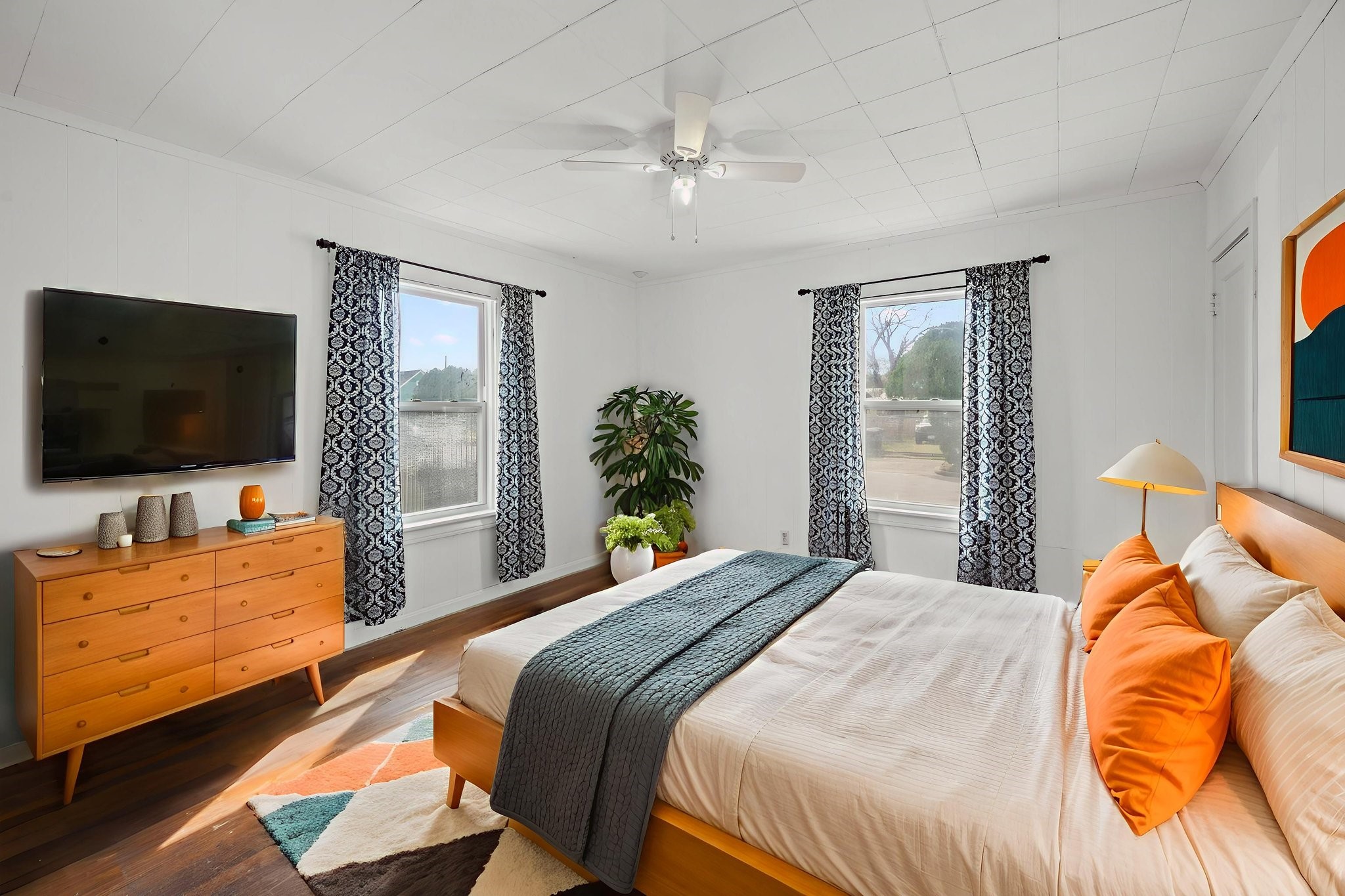 5519 Hillman Street Houston, TX 77023 - Photo 12 of 22 a bedroom with a bed and a flat screen tv