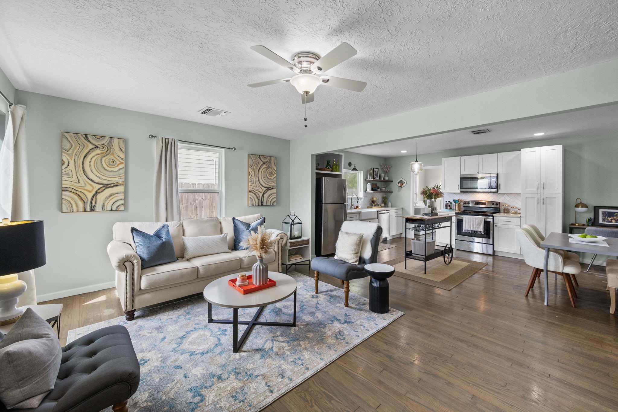 5519 Hillman Street Houston, TX 77023 - Photo 2 of 22 a living room with furniture and wooden floor