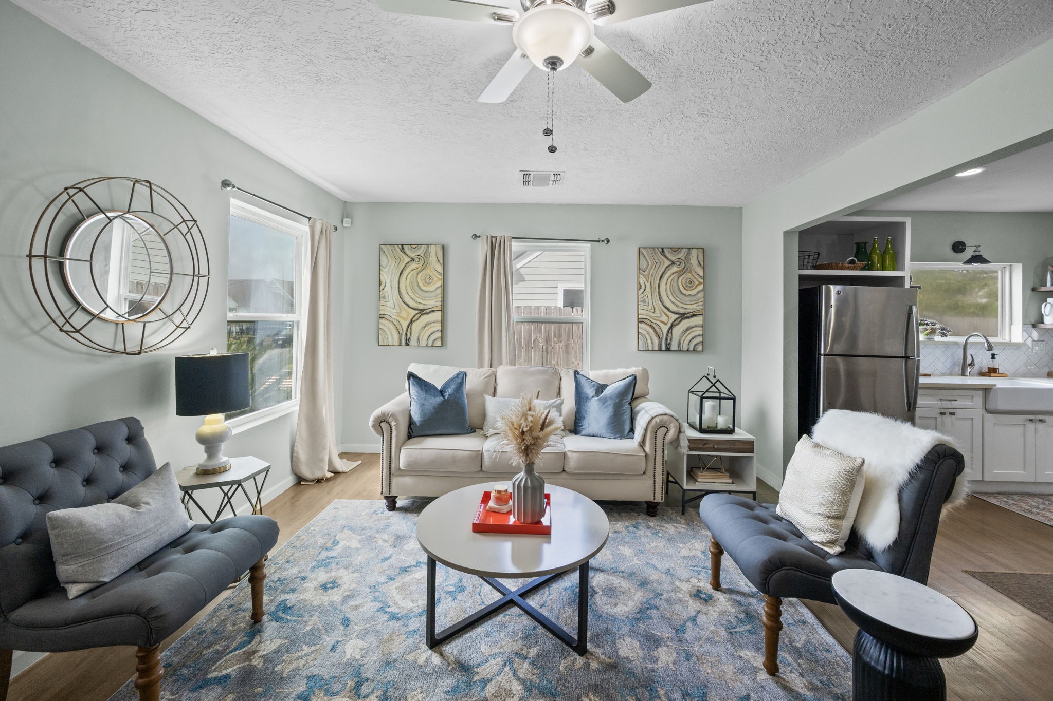5519 Hillman Street Houston, TX 77023 - Photo 3 of 22 a living room with furniture and a chandelier