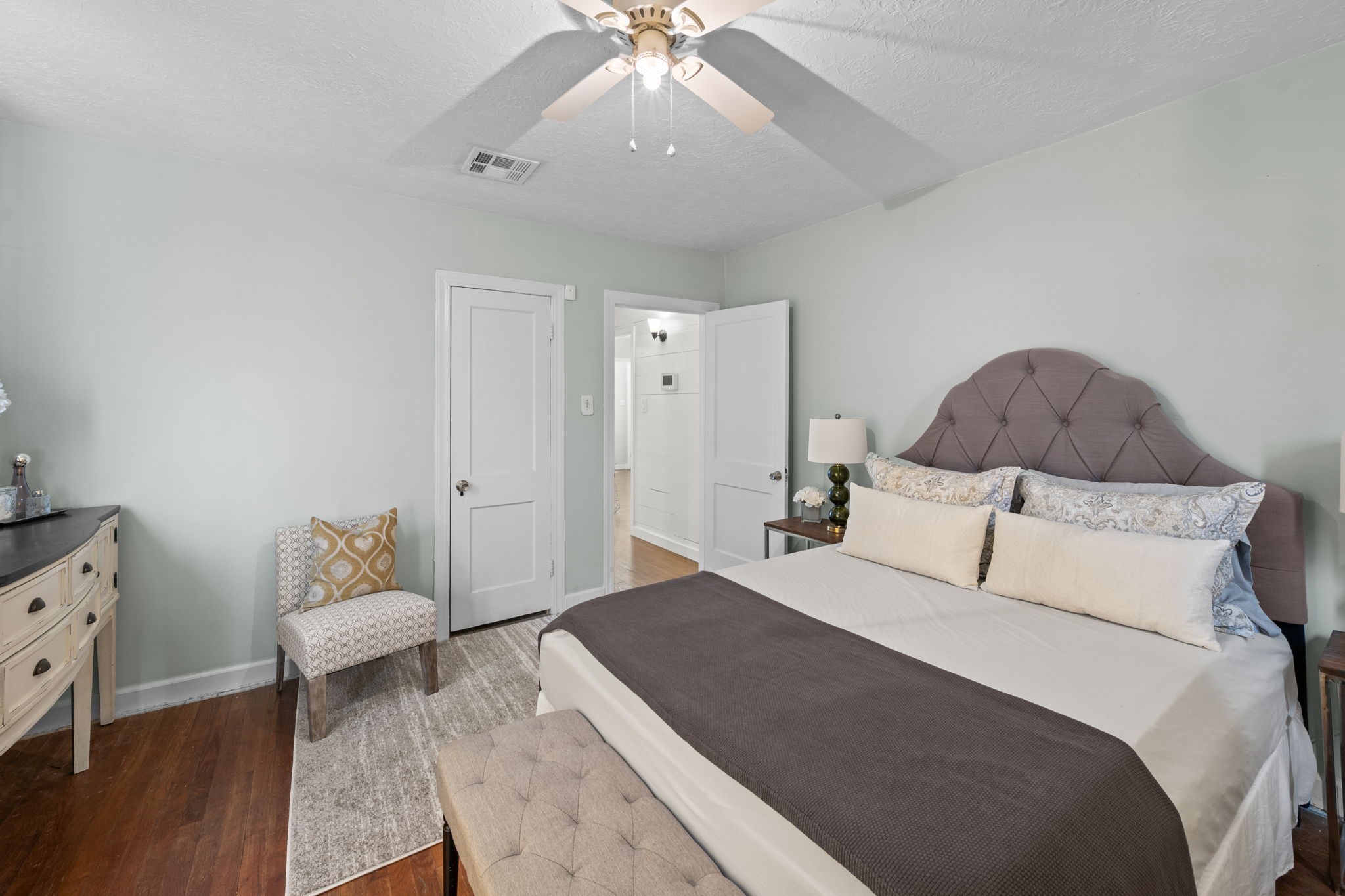 5519 Hillman Street Houston, TX 77023 - Photo 10 of 22 a bedroom with a bed and a dresser