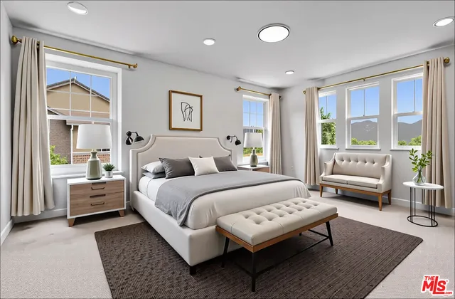 a bedroom with a bed and a couch