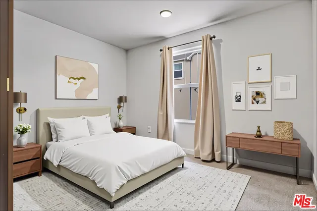 a bedroom with a bed and a cabinets