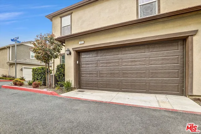 a front view of a house with a garage