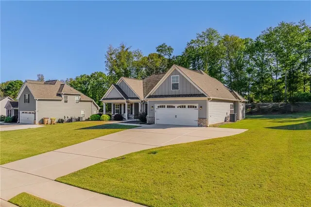 a front view of a house with yard