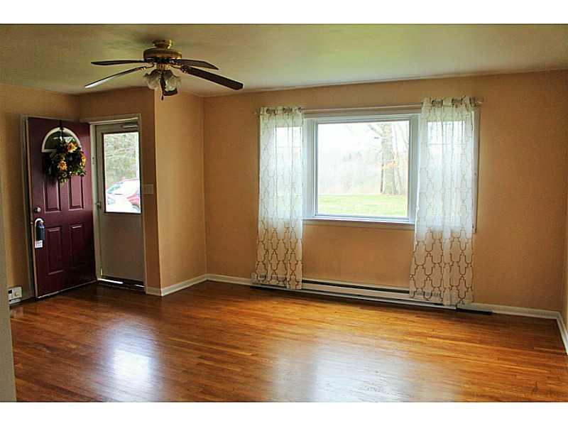 110 Mitchell Road West Middlesex, PA 16159 - Photo 4 of 12 Living Room. Comfortable living space with gleaming hardwood floors