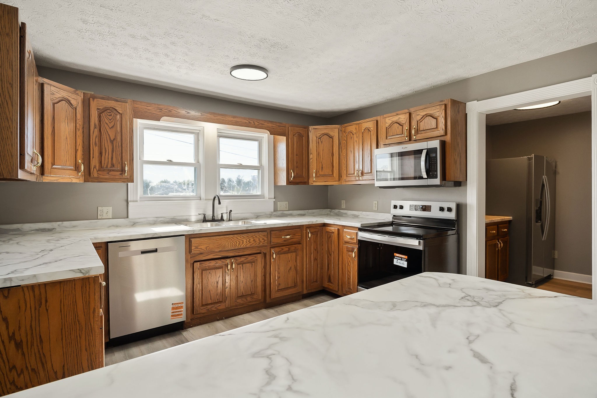 415 Allen Ferry Road Smithville, TN 37166 - Photo 11 of 41 a kitchen with stainless steel appliances granite countertop a stove a sink dishwasher a refrigerator and a microwave oven