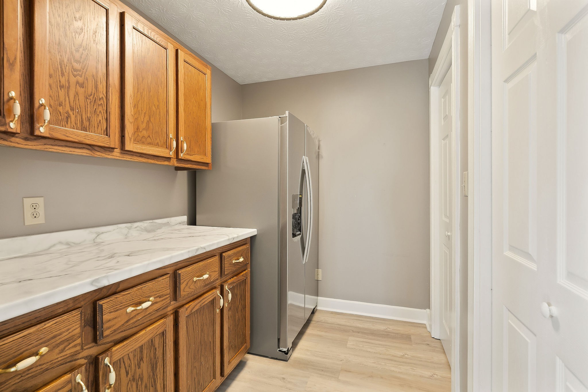 415 Allen Ferry Road Smithville, TN 37166 - Photo 12 of 41 a kitchen with stainless steel appliances granite countertop a refrigerator and a sink