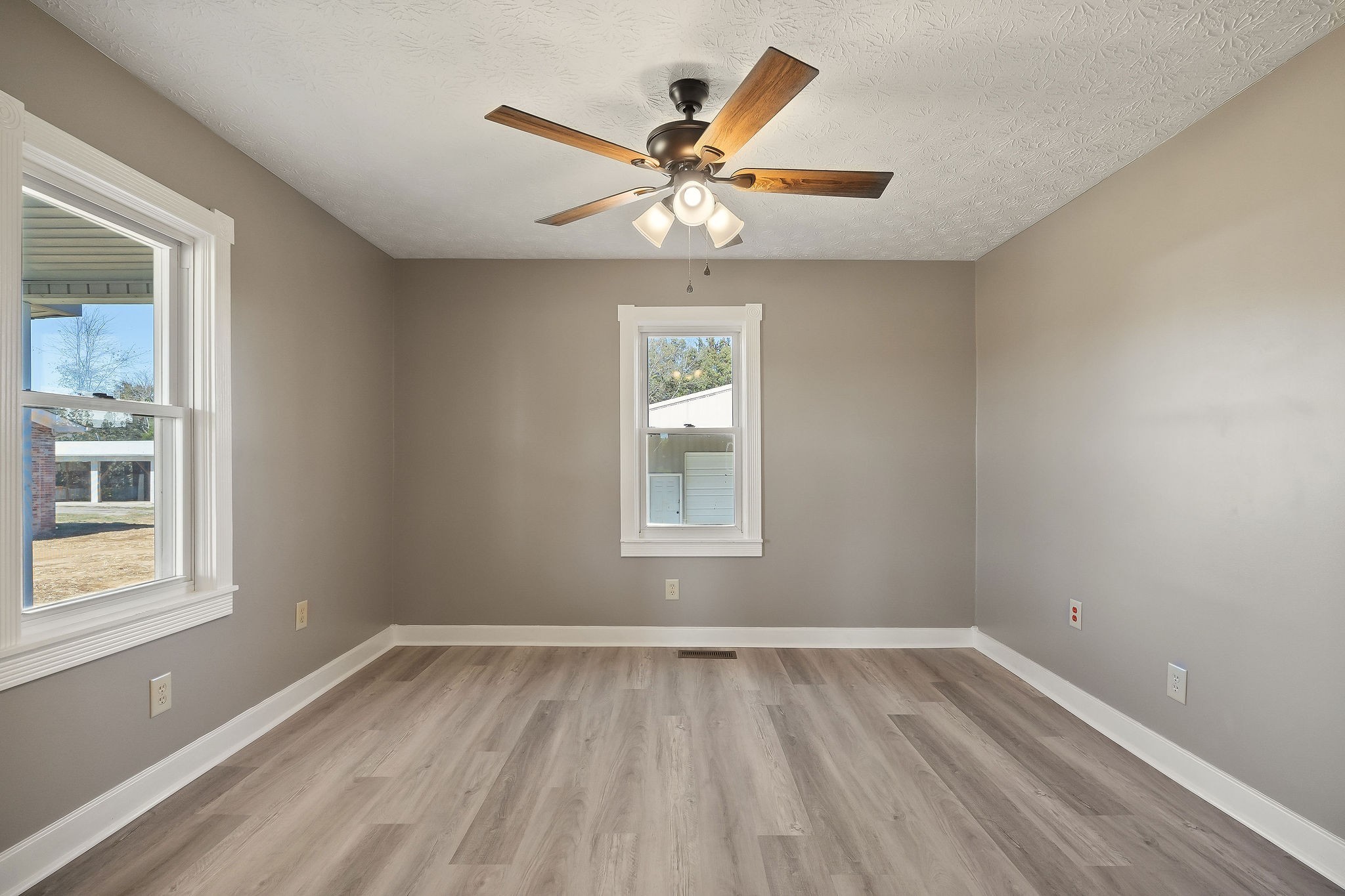415 Allen Ferry Road Smithville, TN 37166 - Photo 20 of 41 a view of an empty room with wooden floor and a window