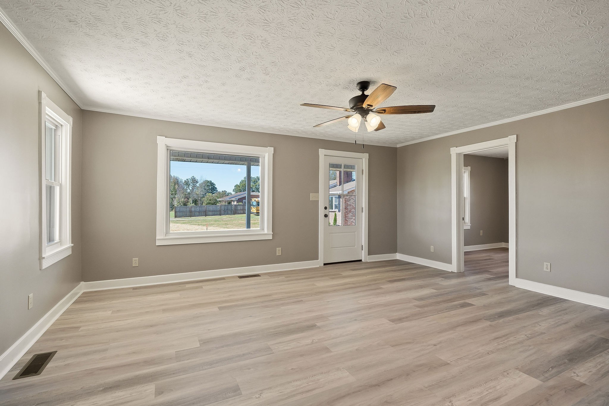 415 Allen Ferry Road Smithville, TN 37166 - Photo 7 of 41 a view of an empty room with a window and a chandelier fan