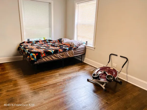 a bedroom with bed and a window