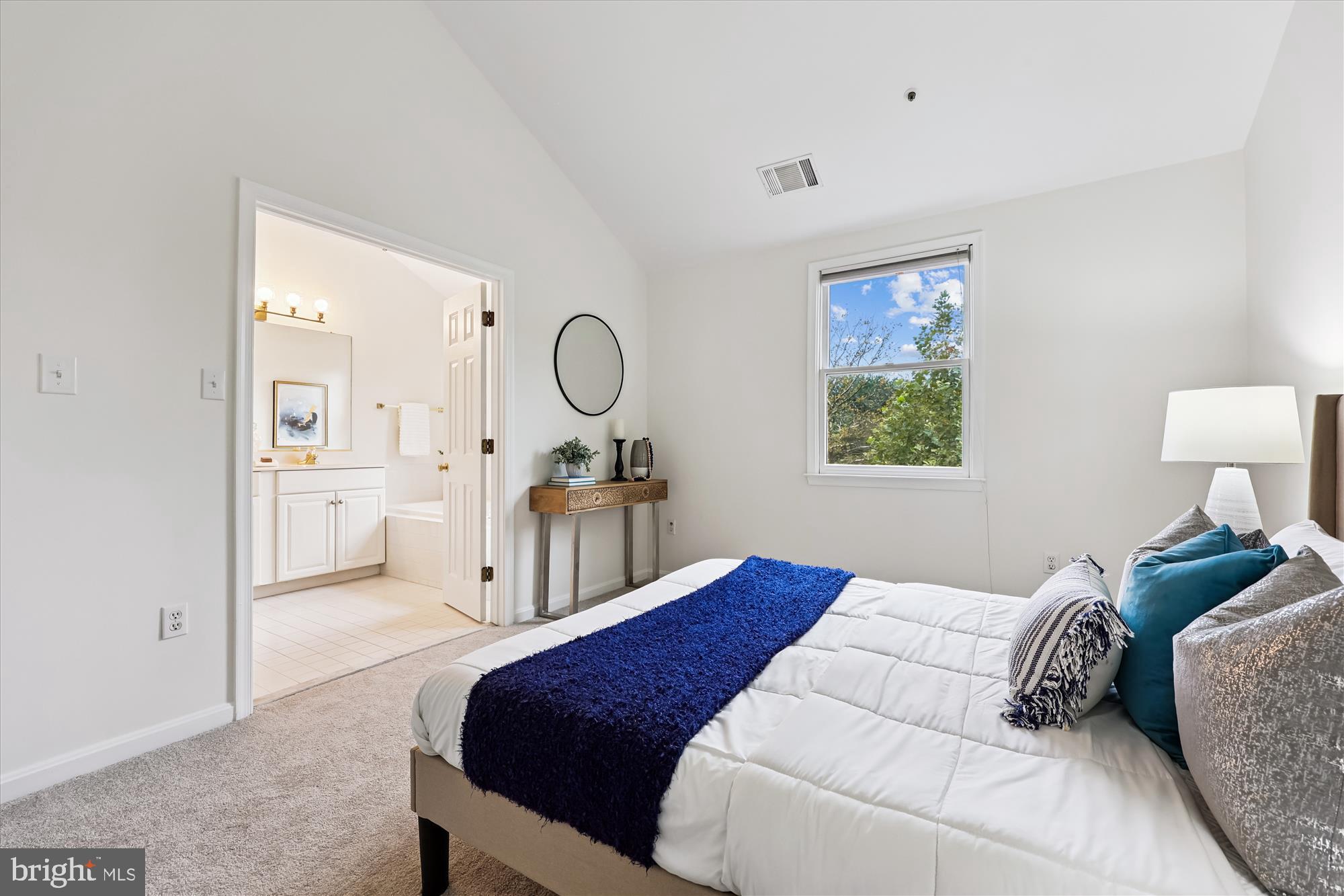 473 Tschiffely Square Road Gaithersburg, MD 20878 - Photo 21 of 64 a bedroom with a bed a mirror and a window