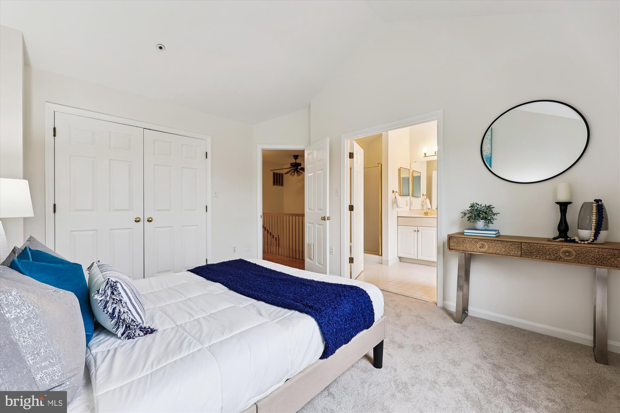 473 Tschiffely Square Road Gaithersburg, MD 20878 - Photo 22 of 64 a spacious bedroom with a bed a mirror and a table