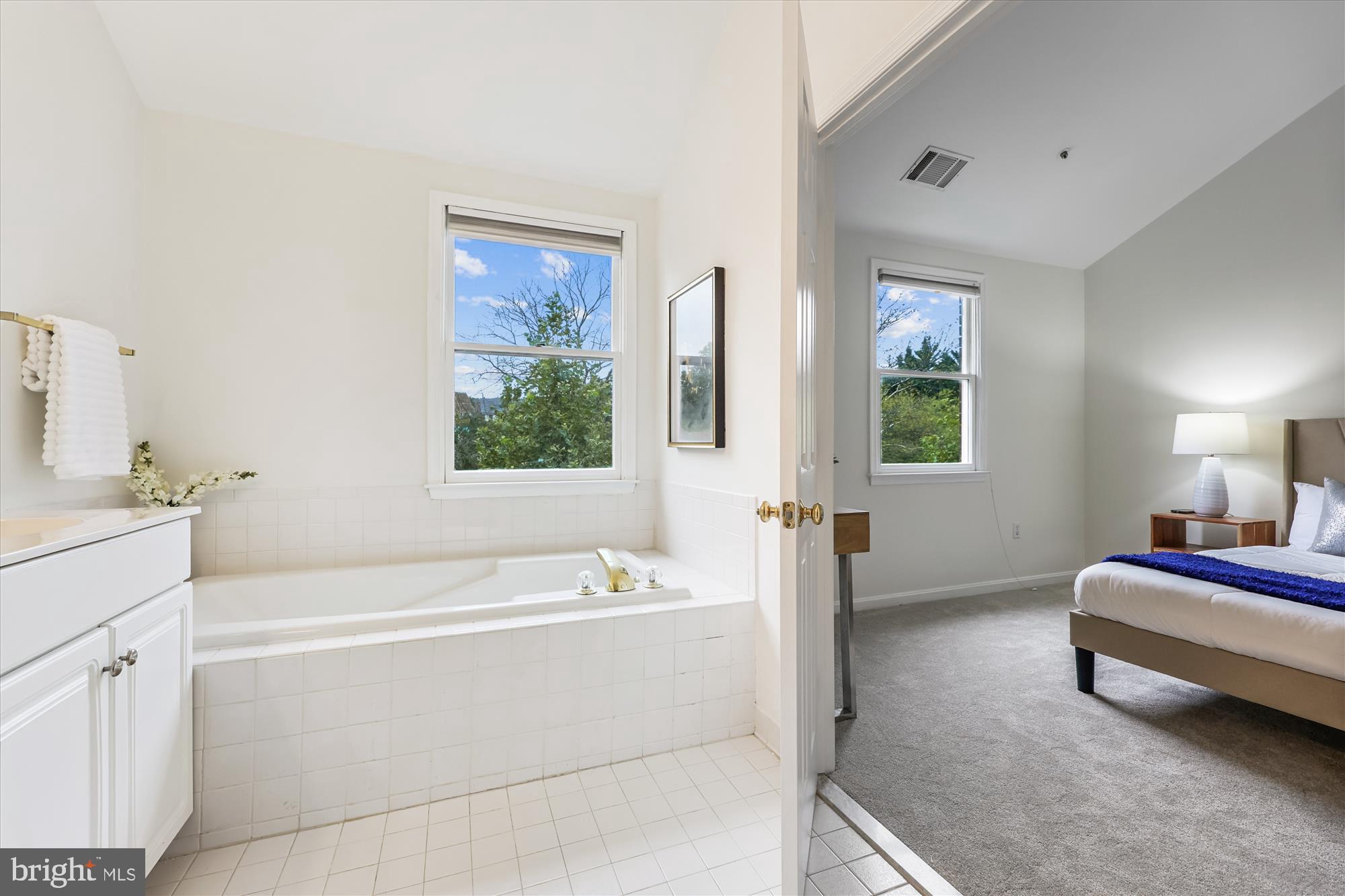 473 Tschiffely Square Road Gaithersburg, MD 20878 - Photo 23 of 64 a spacious bedroom with a bed and a window