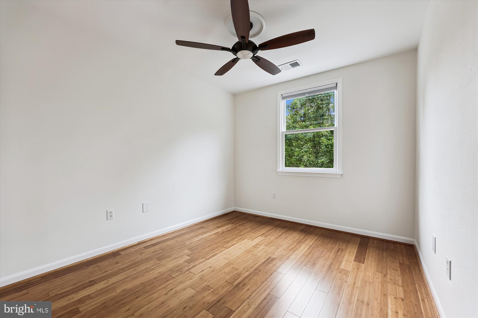 473 Tschiffely Square Road Gaithersburg, MD 20878 - Photo 27 of 64 a view of empty room with wooden floor and fan