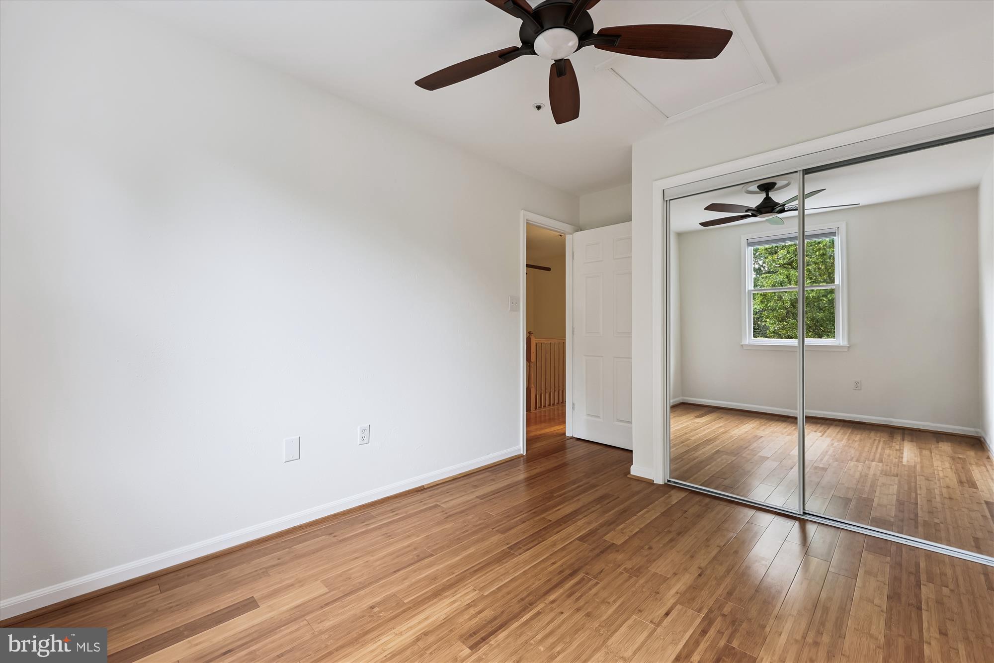 473 Tschiffely Square Road Gaithersburg, MD 20878 - Photo 29 of 64 an empty room with wooden floor fan and windows