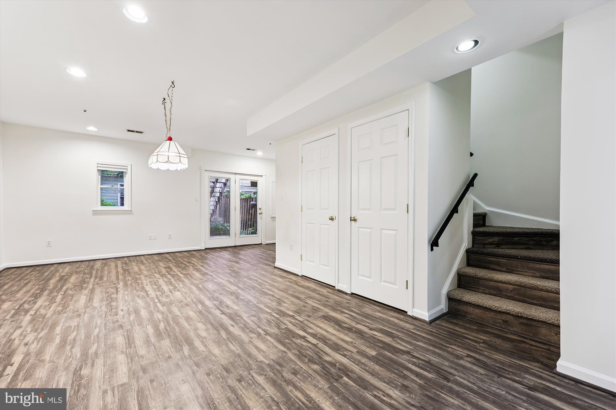 473 Tschiffely Square Road Gaithersburg, MD 20878 - Photo 34 of 64 a view of an empty room with wooden floor and staircase