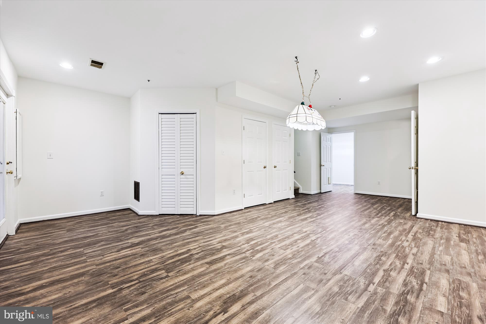 473 Tschiffely Square Road Gaithersburg, MD 20878 - Photo 36 of 64 wooden floor in an empty room with a window