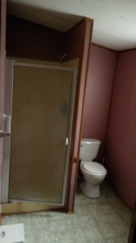 177 Cyler Road Gray, GA 31032 - Photo 12 of 15 a toilet sitting in a bathroom next to a sink