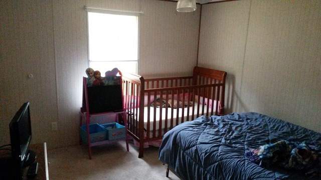 177 Cyler Road Gray, GA 31032 - Photo 13 of 15 a bedroom with a bed and a television