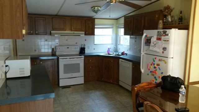 177 Cyler Road Gray, GA 31032 - Photo 5 of 15 a kitchen with a sink a stove and refrigerator