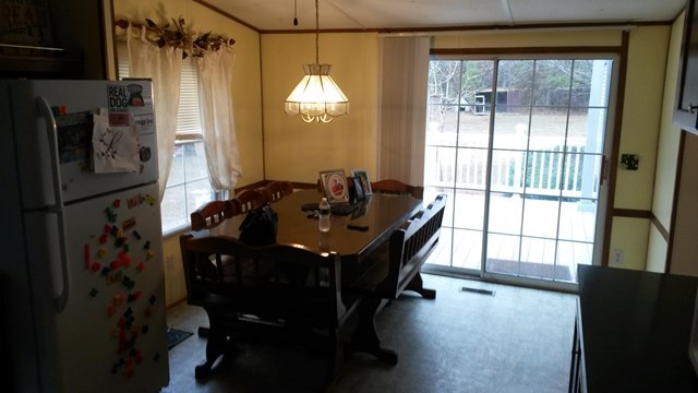 177 Cyler Road Gray, GA 31032 - Photo 6 of 15 a room with a balcony a bed and a chandelier