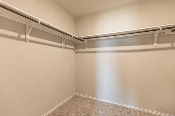 a view of a room with racks on the wall