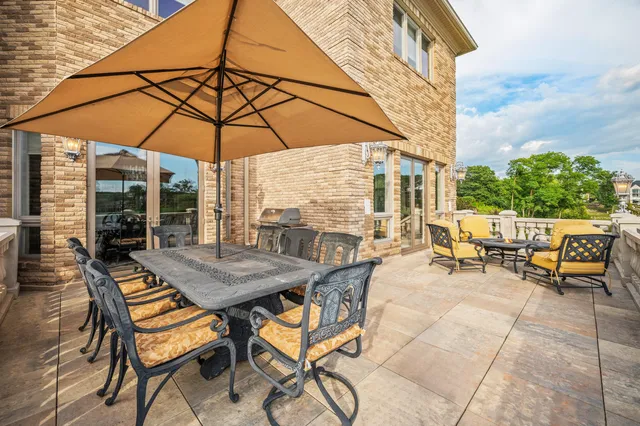 a living room with furniture and a lamp