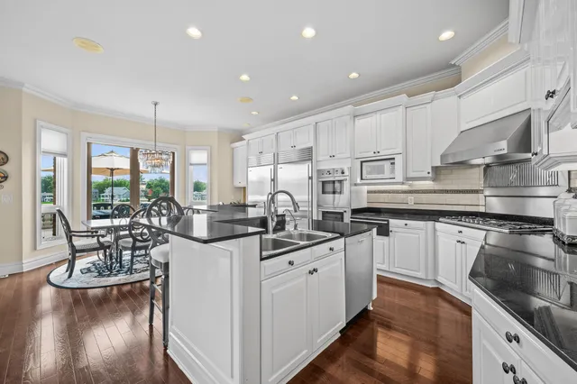 a bathroom with a sink a washer and dryer