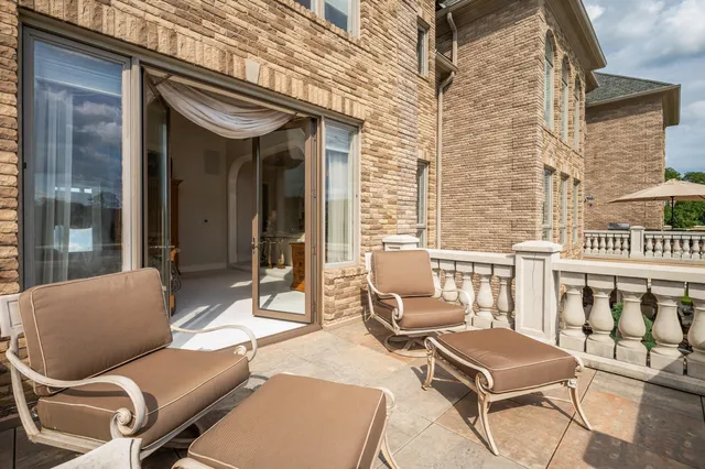 a view of a lake with houses in back