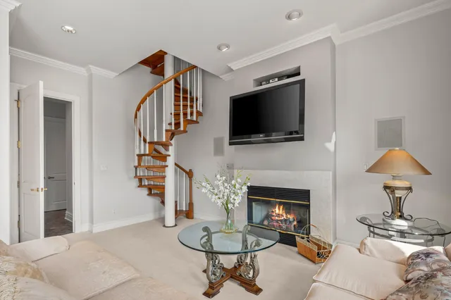an aerial view of a house with a garden and lake view