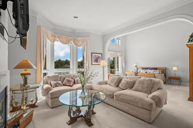 an aerial view of a house with a garden and swimming pool