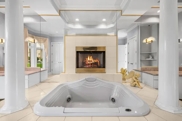 an aerial view of a house with a lake view